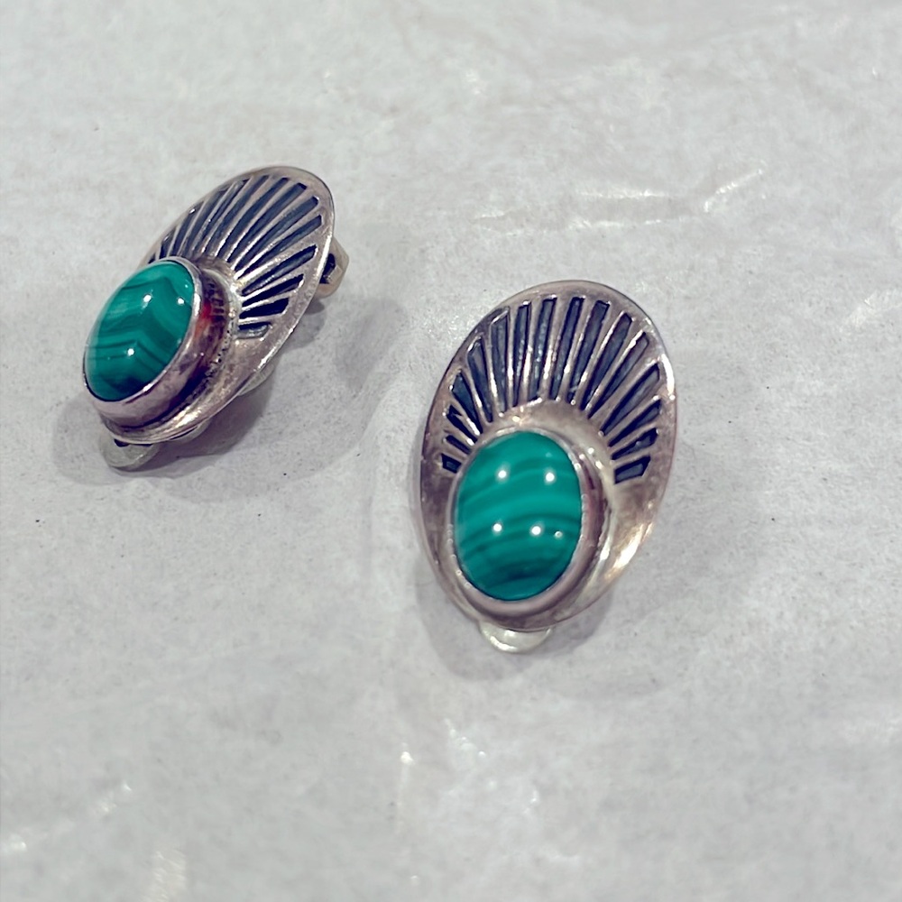 Vintage Sterling Silver clip on earrings. With beautiful green stone.